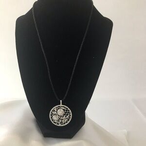 Crystal look pendant on‎ thin black silk rope